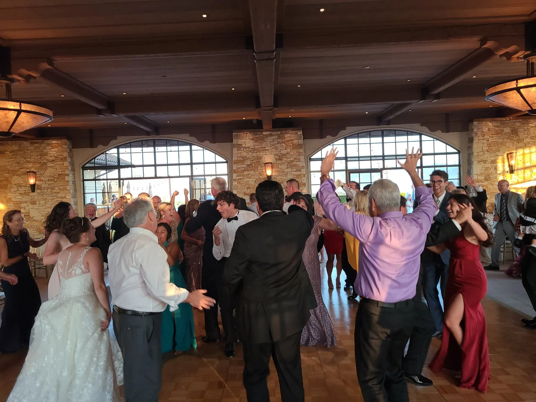 A wedding dance floor filled with guests