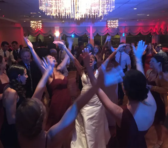 A couple celebrating together on an Icon DJ wedding dance floor